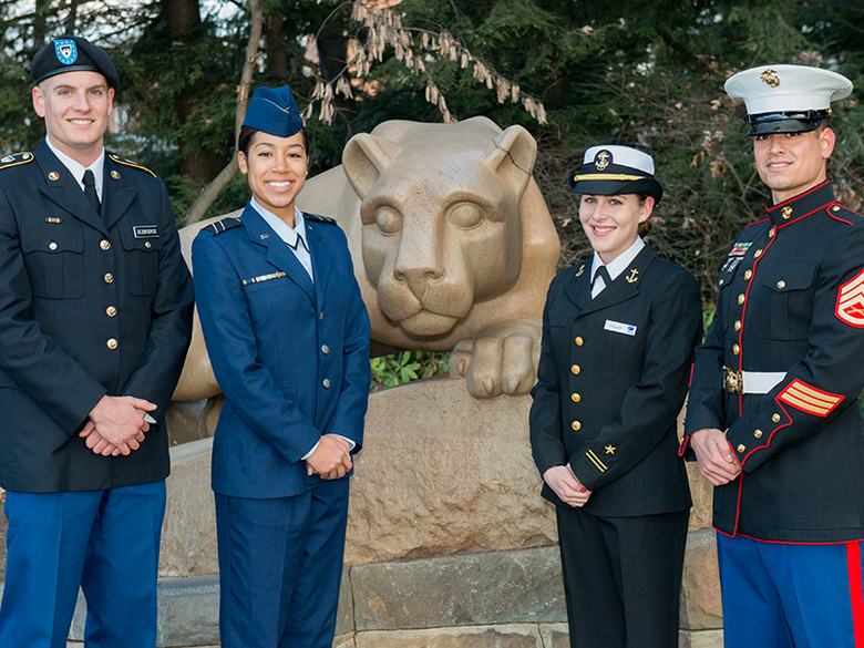 ROTC members standing by Lion Shrine